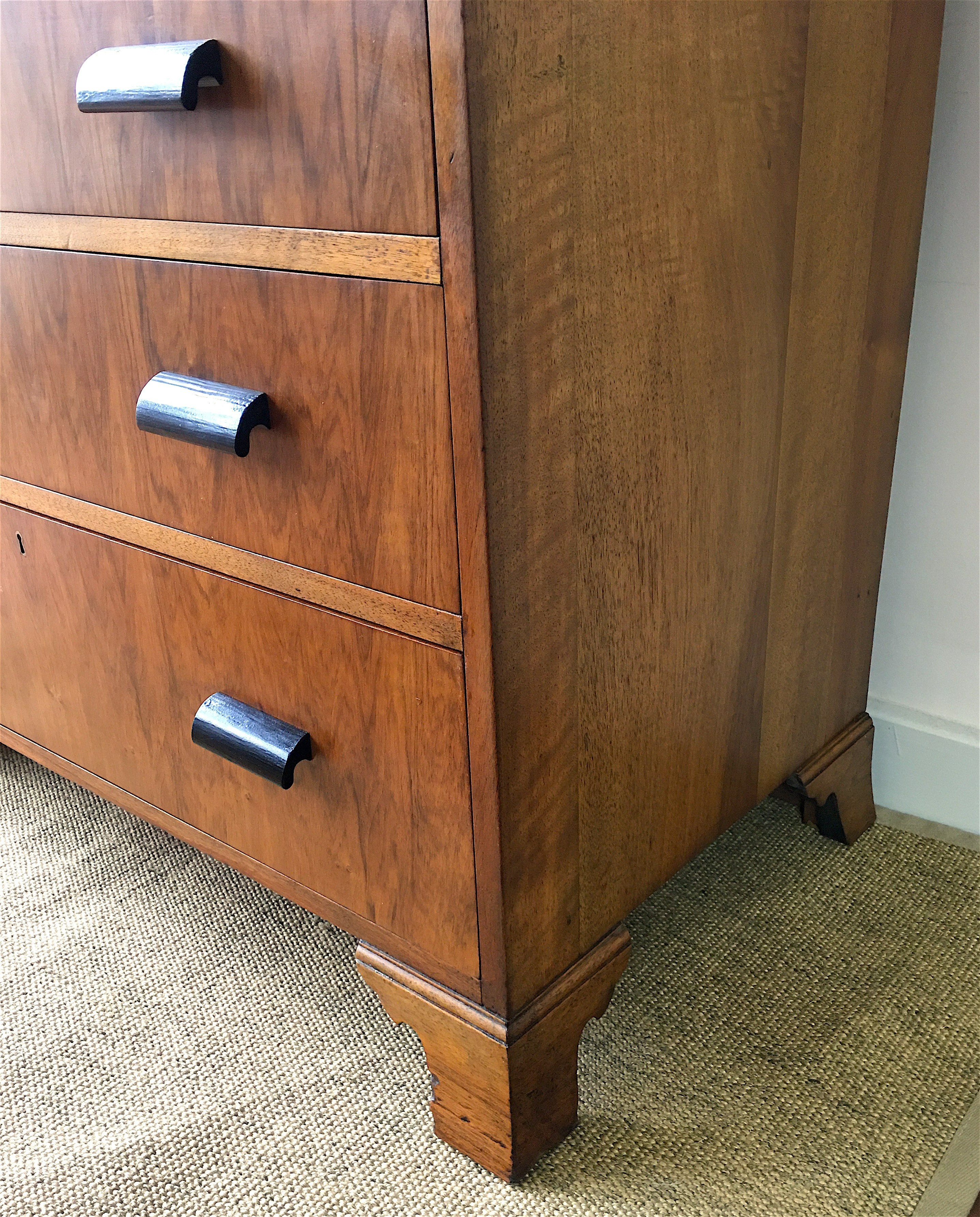 An Art Deco style figured walnut chest of four drawers, width 92cm, depth 50cm, height 83cm